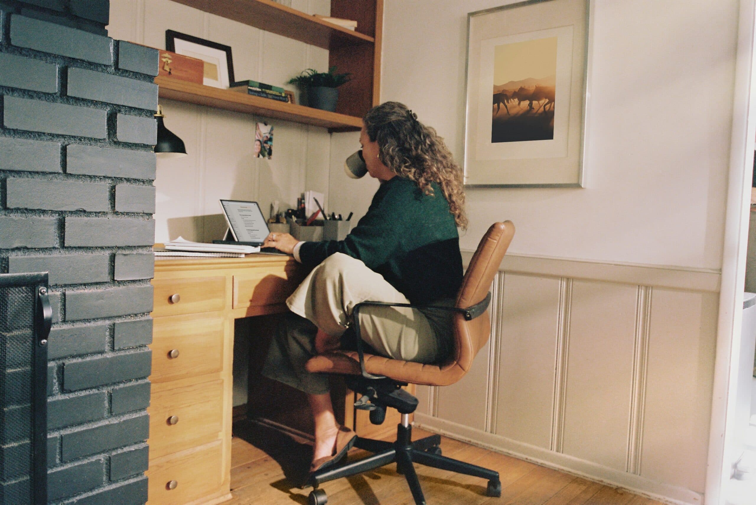 Woman at chair using laptop